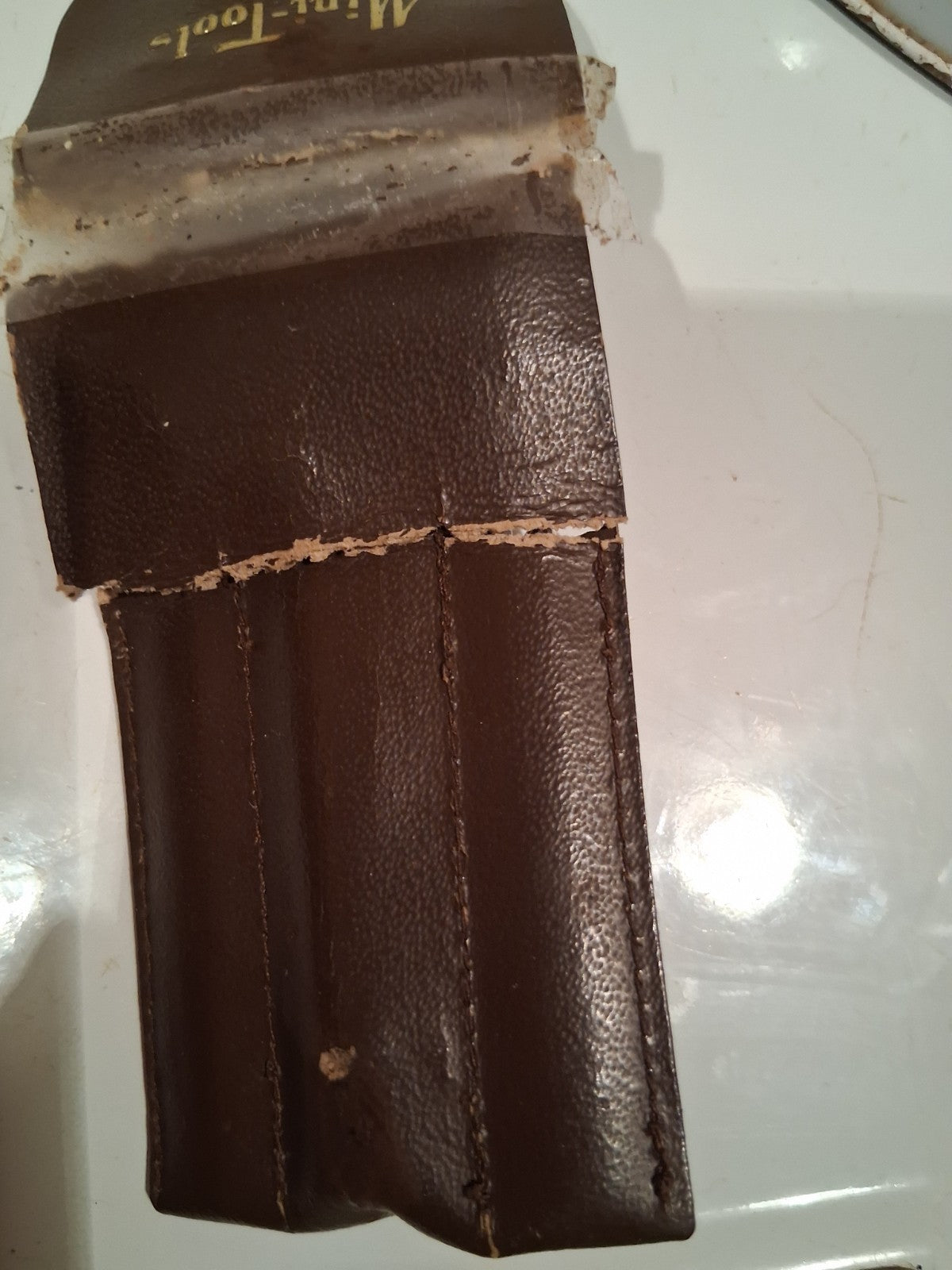 Leather tool pouch labeled 'Mini-Tools' made in Australia