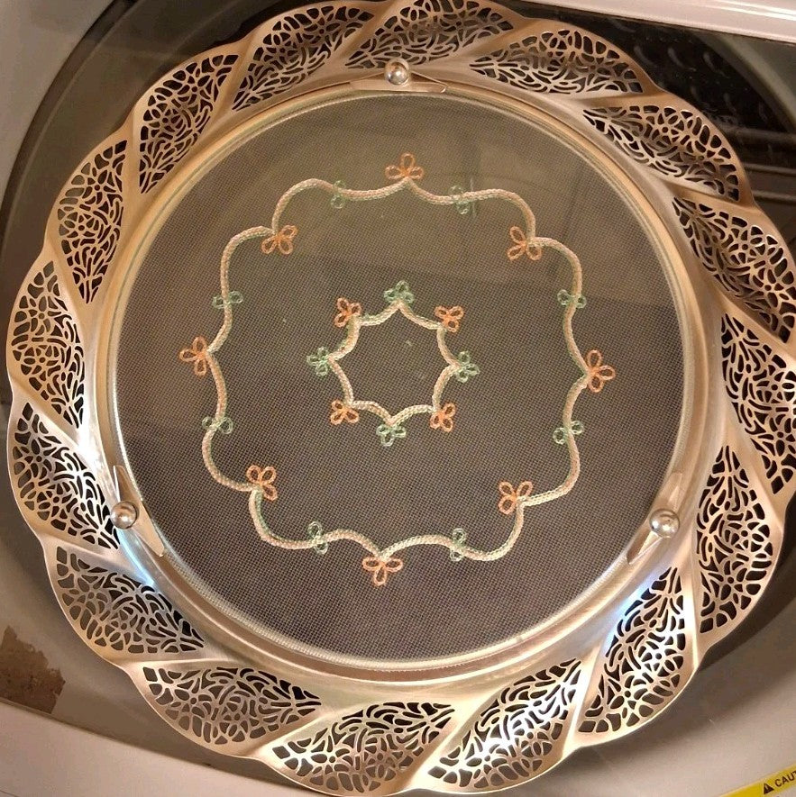 Silver-plated oval serving tray with ornate grapevine border and enamel center