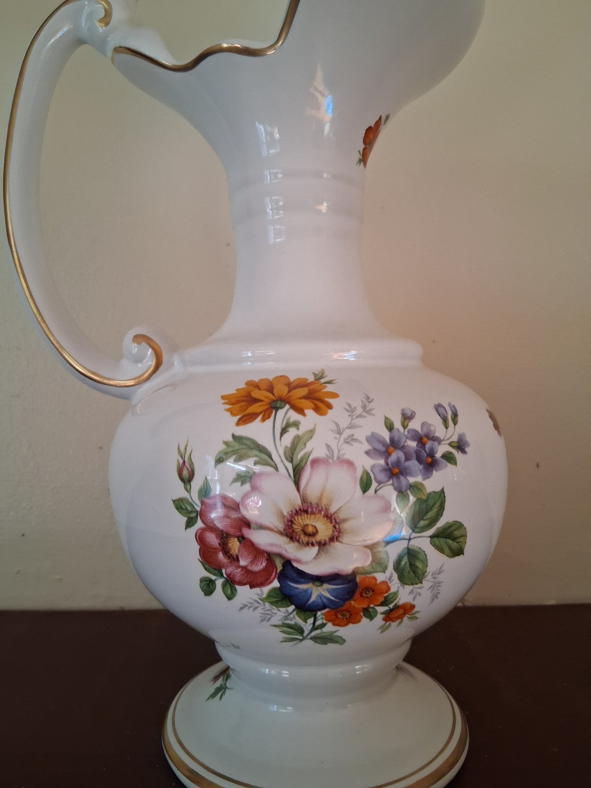 Porcelain vase with hand-painted floral decoration and gilt accents
