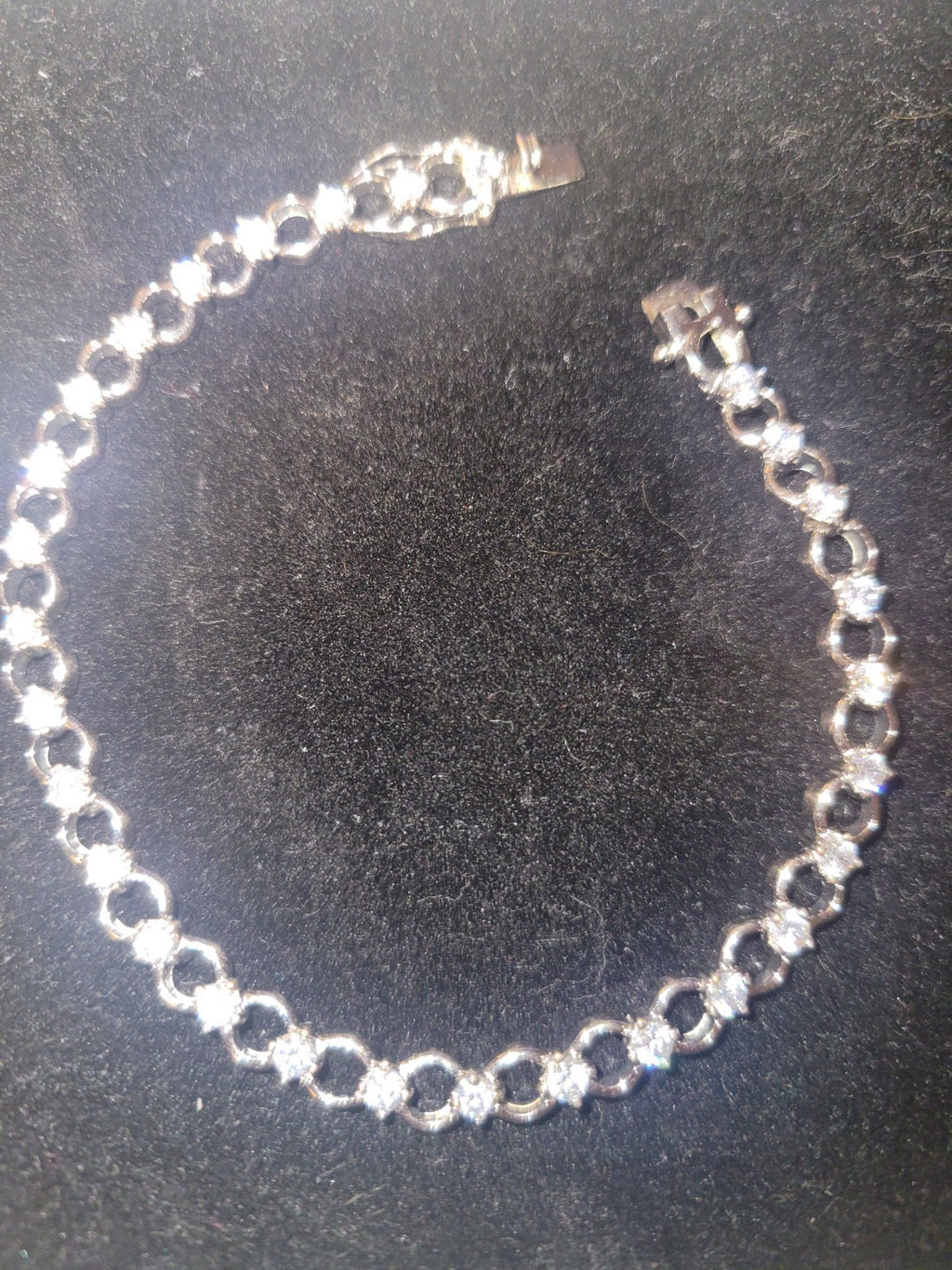 Tennis bracelet with oval-cut gems and diamond accents 8" 12.89g
