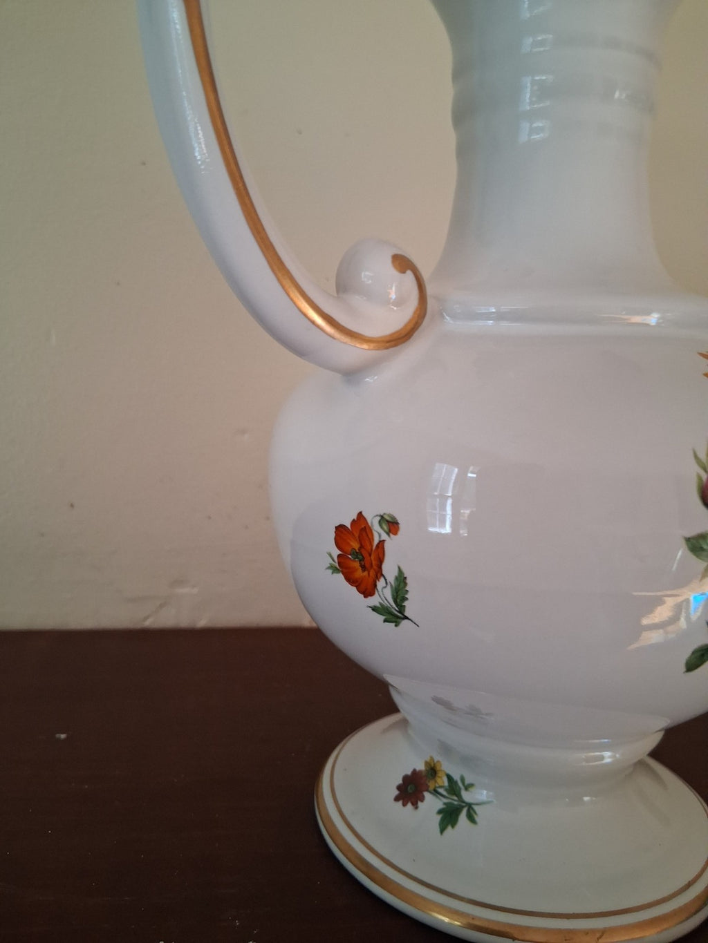 Porcelain vase with hand-painted floral decoration and gilt accents