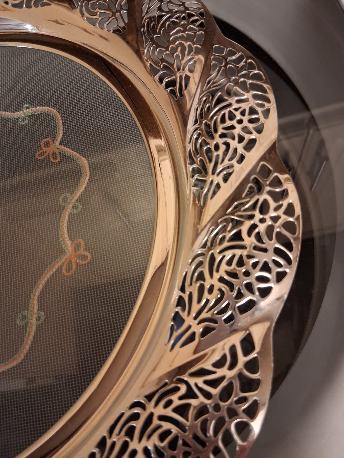 Silver-plated oval serving tray with ornate grapevine border and enamel center