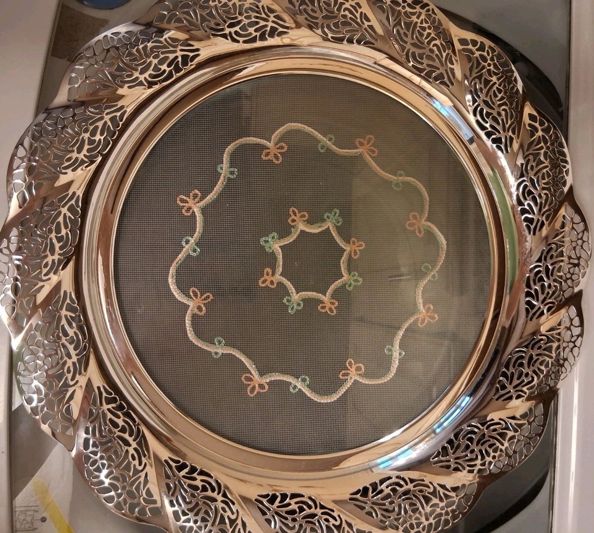 Silver-plated oval serving tray with ornate grapevine border and enamel center