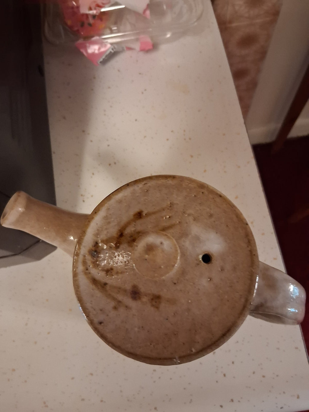 Stoneware studio pottery pitcher with abstract botanical decoration