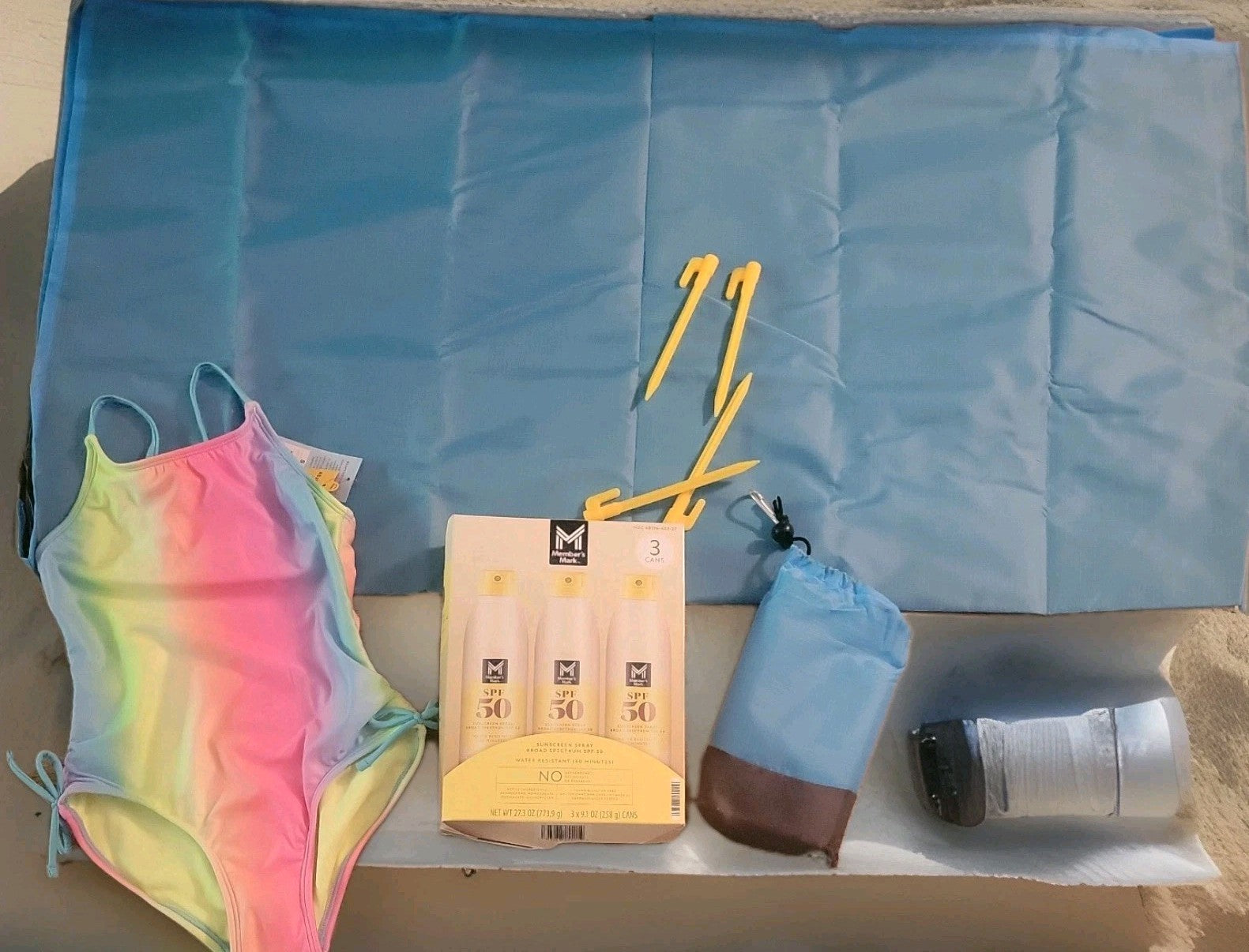Sunscreen, sand coverer  & Bathing suit