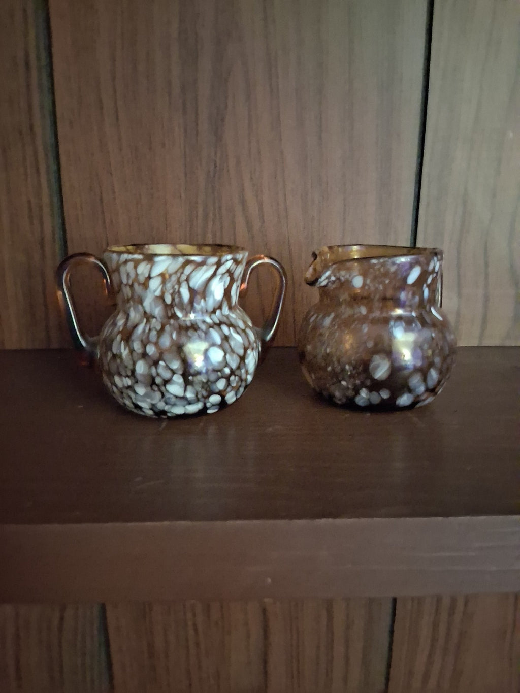 Pair of pressed glass sugar bowls in amber carnival glass Star and File pattern