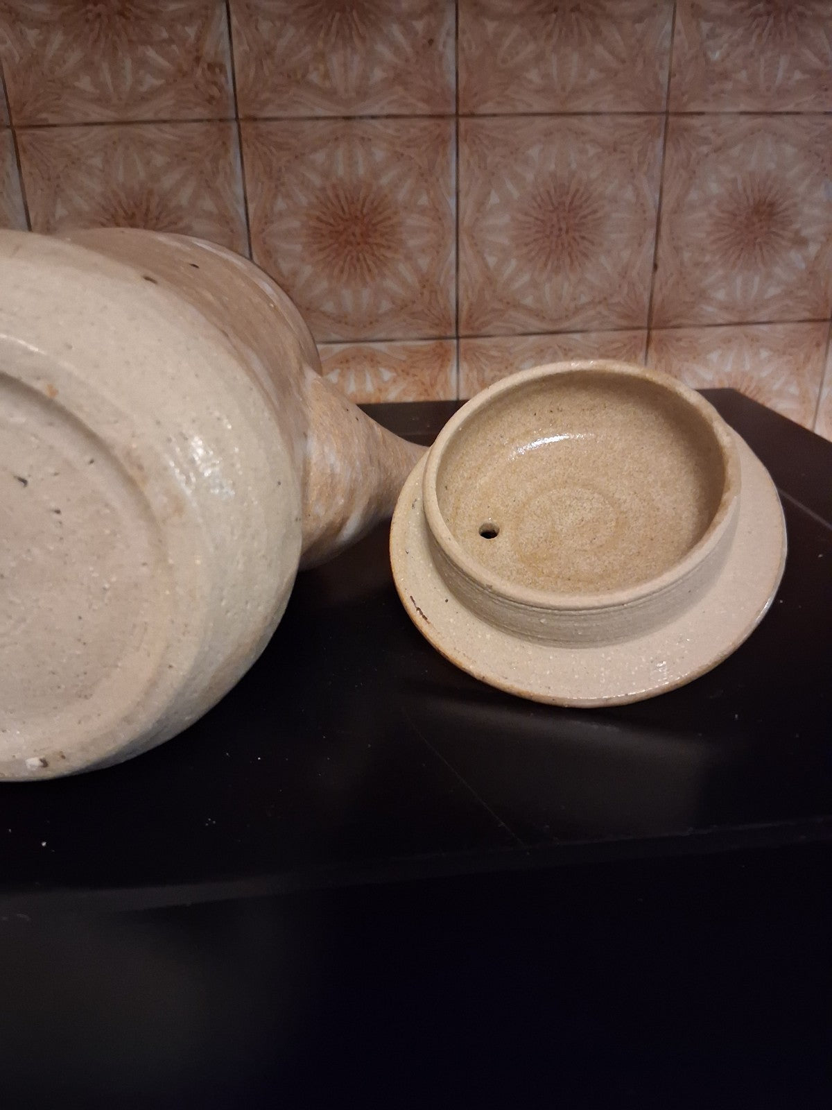 Stoneware studio pottery pitcher with abstract botanical decoration