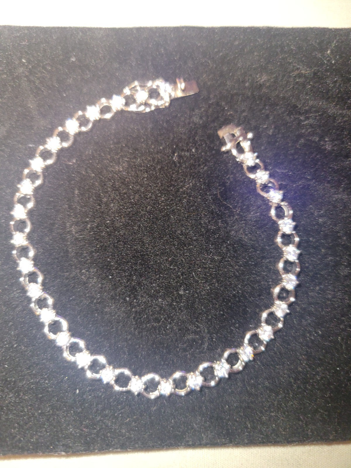 Tennis bracelet with oval-cut gems and diamond accents 8" 12.89g