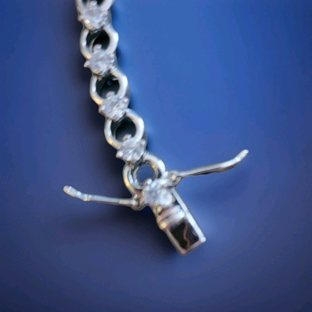 Tennis bracelet with oval-cut gems and diamond accents 8" 12.89g