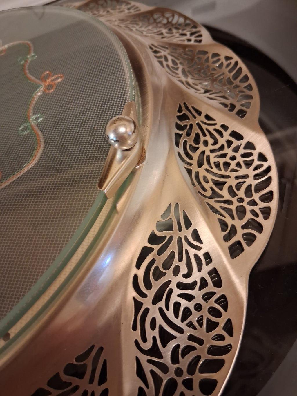 Silver-plated oval serving tray with ornate grapevine border and enamel center