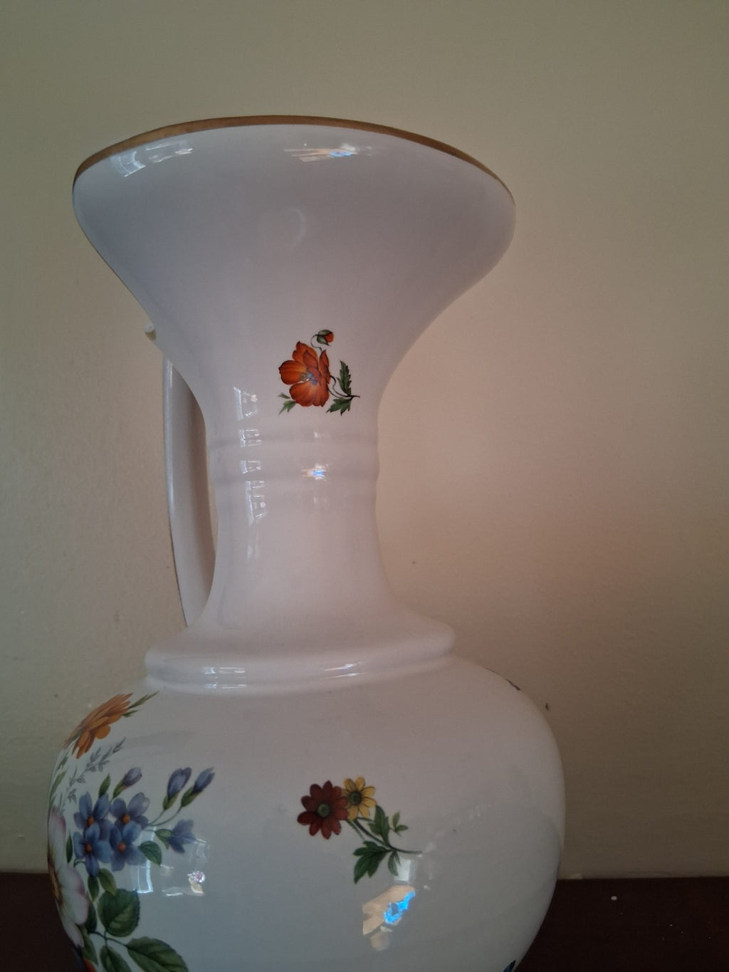 Porcelain vase with hand-painted floral decoration and gilt accents