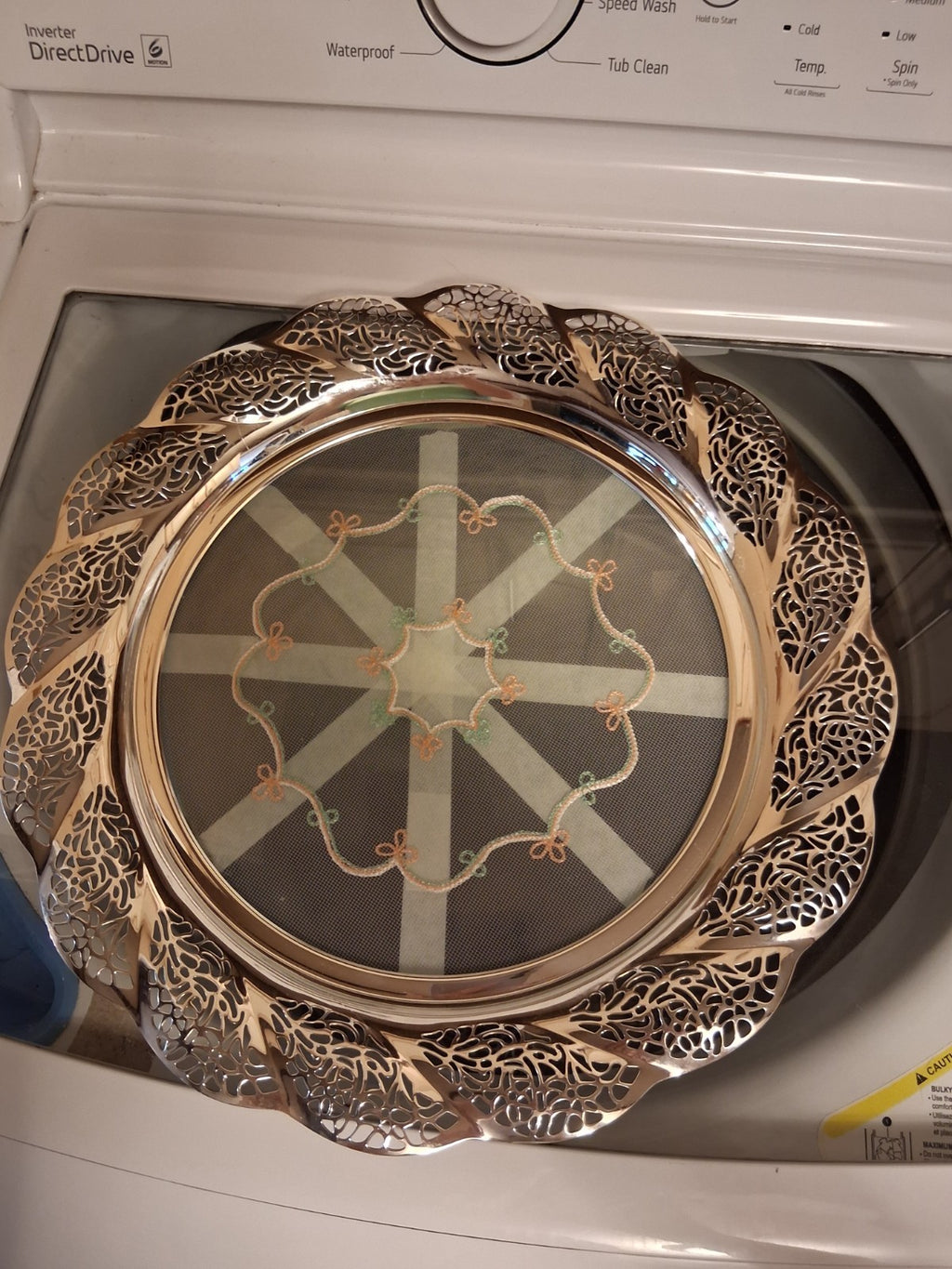 Silver-plated oval serving tray with ornate grapevine border and enamel center