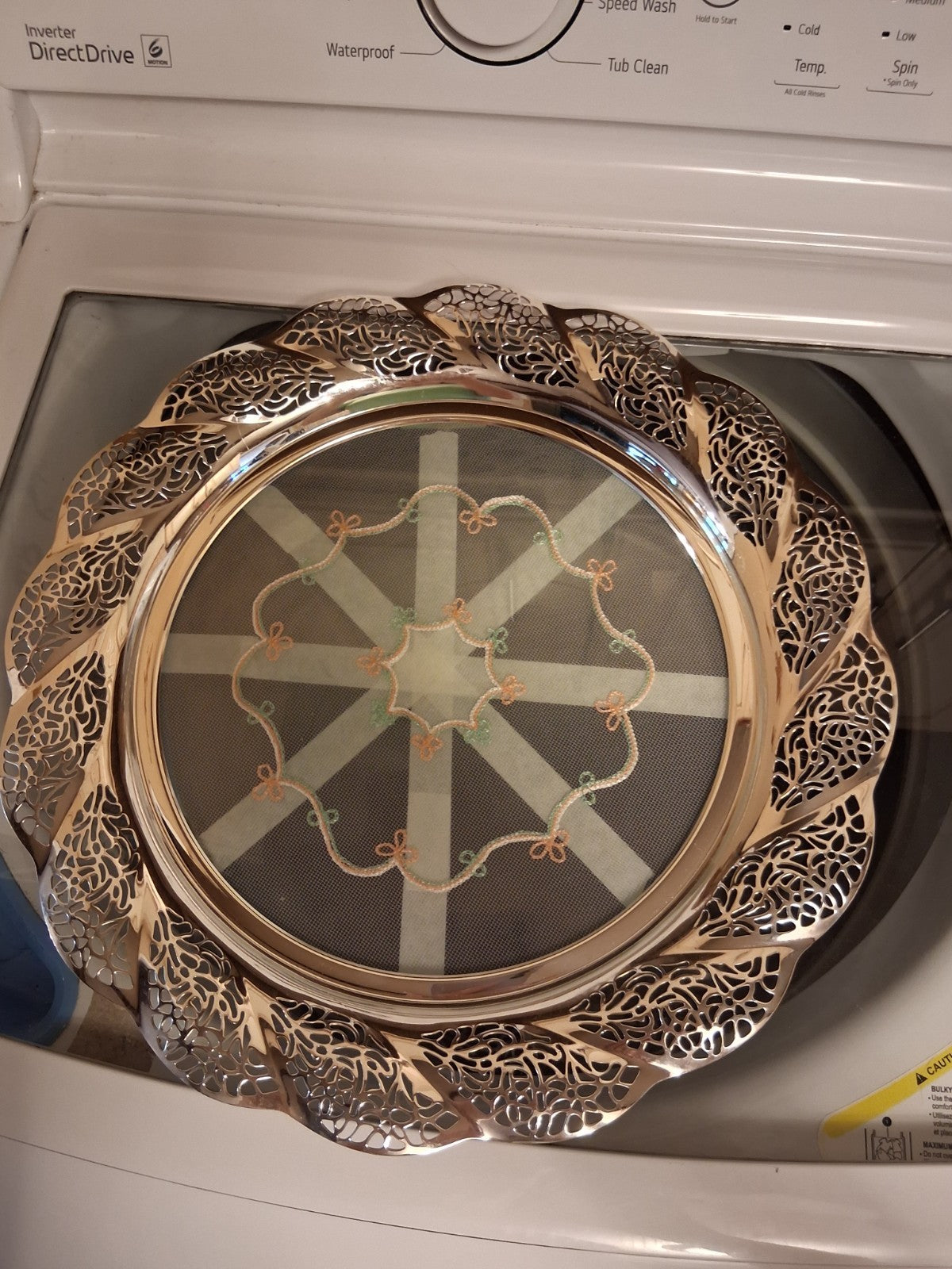 Silver-plated oval serving tray with ornate grapevine border and enamel center