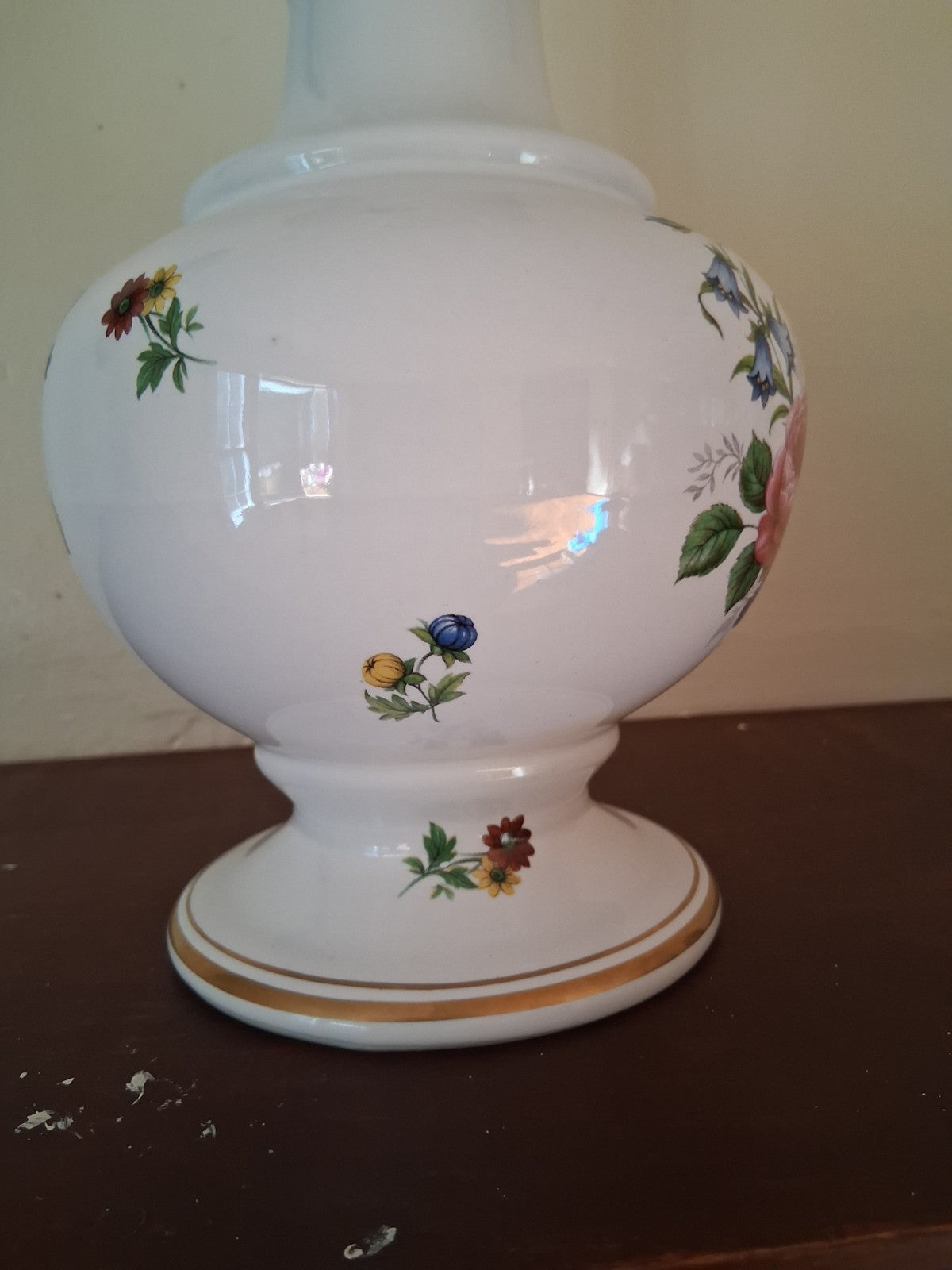 Porcelain vase with hand-painted floral decoration and gilt accents