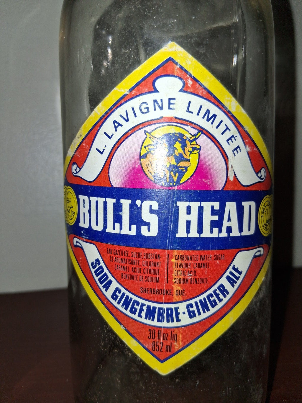  Glass soda bottle with 'Bull's Head Ginger Ale' label by Lavigne Limited