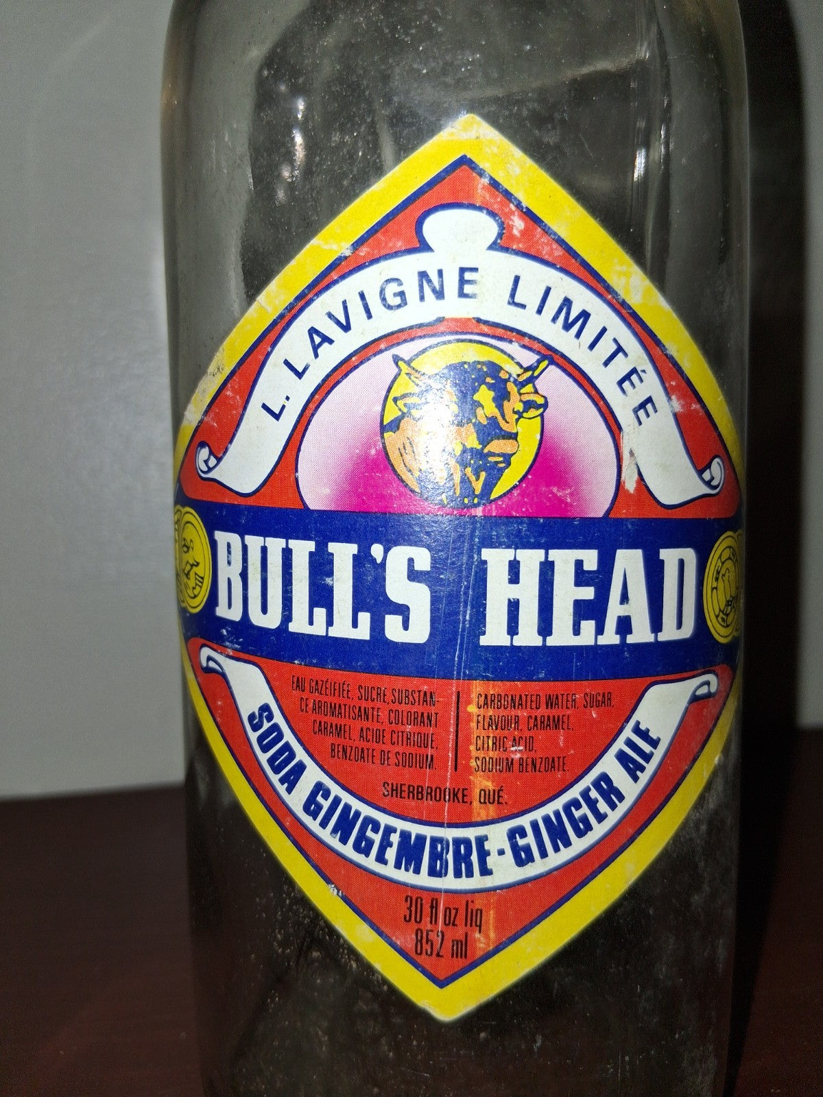  Glass soda bottle with 'Bull's Head Ginger Ale' label by Lavigne Limited