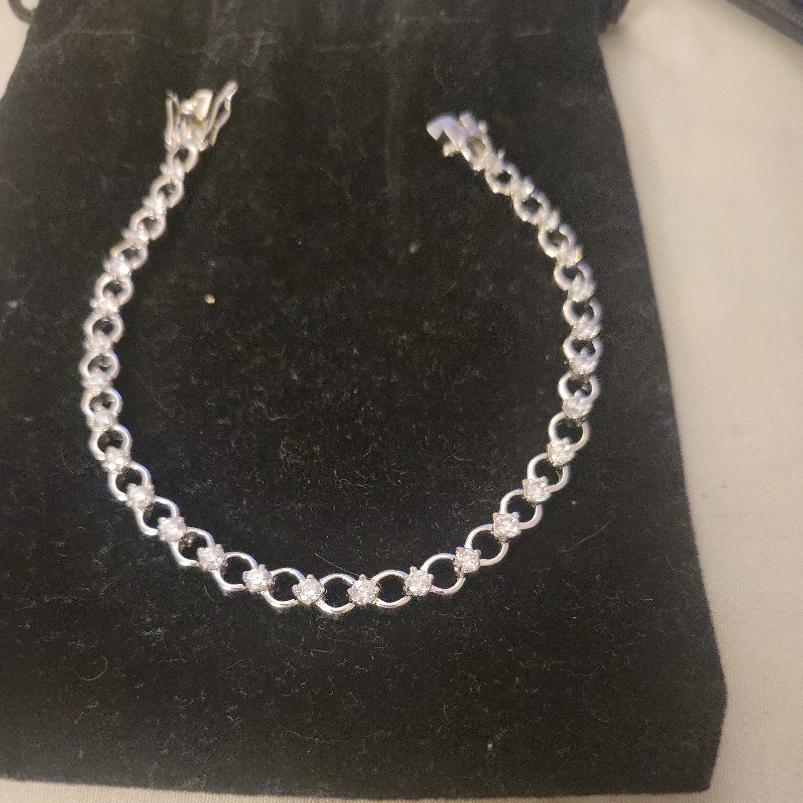 Tennis bracelet with oval-cut gems and diamond accents 8" 12.89g