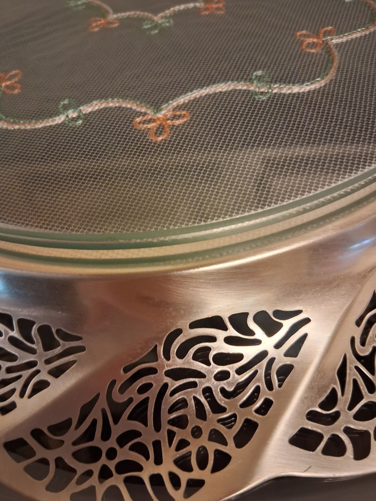 Silver-plated oval serving tray with ornate grapevine border and enamel center