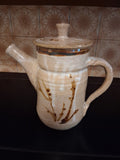 Stoneware studio pottery pitcher with abstract botanical decoration