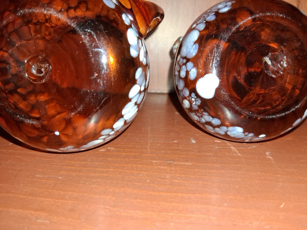 Pair of pressed glass sugar bowls in amber carnival glass Star and File pattern