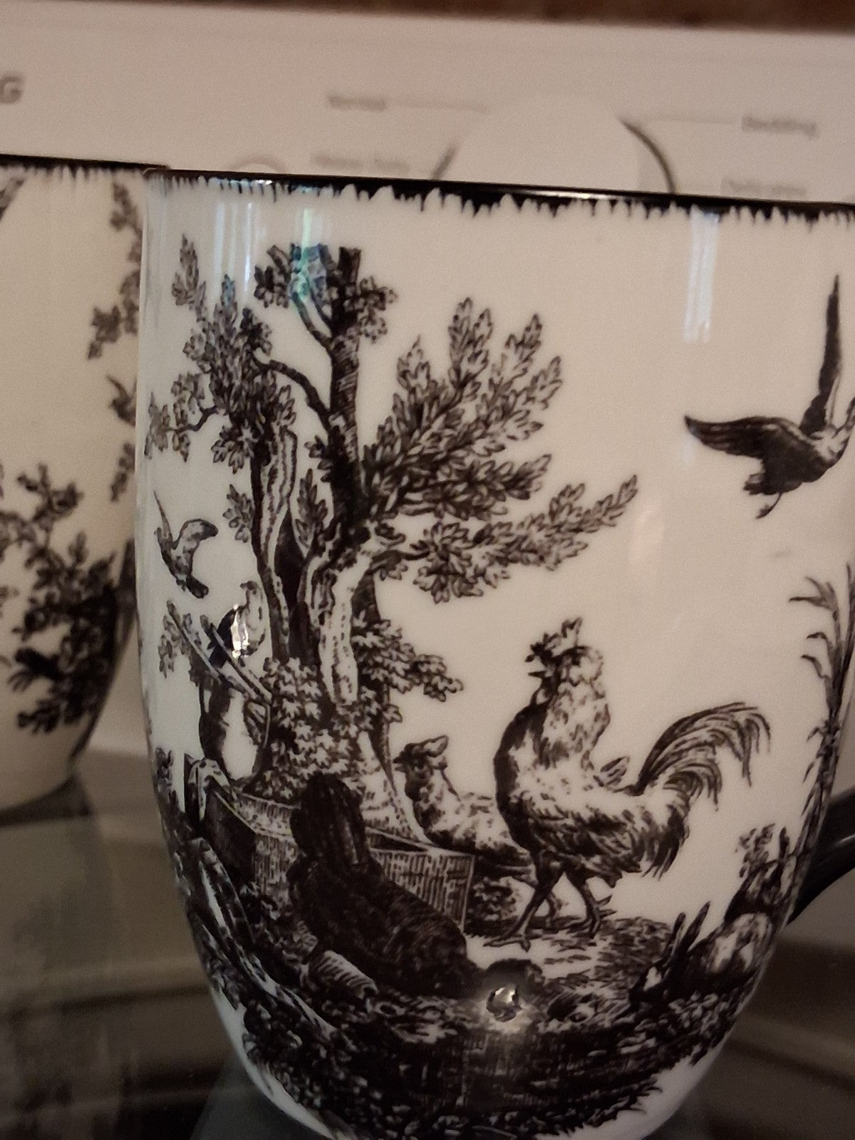 Ceramic mugs with black and white Toile de Jouy pattern by Aux Au Provence