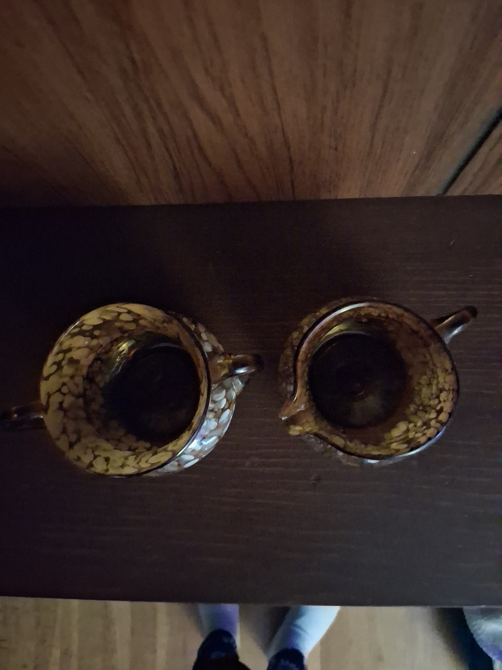 Pair of pressed glass sugar bowls in amber carnival glass Star and File pattern
