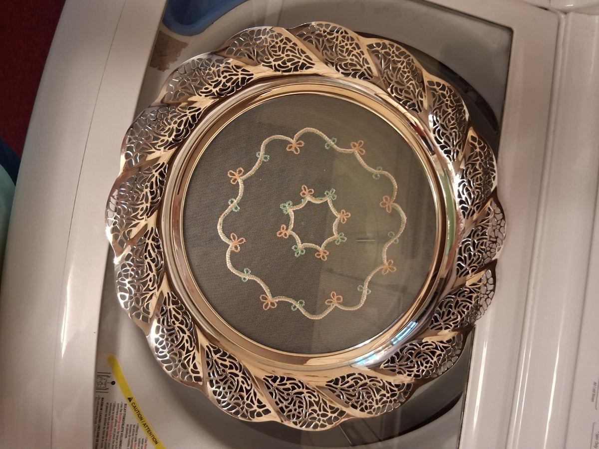 Silver-plated oval serving tray with ornate grapevine border and enamel center