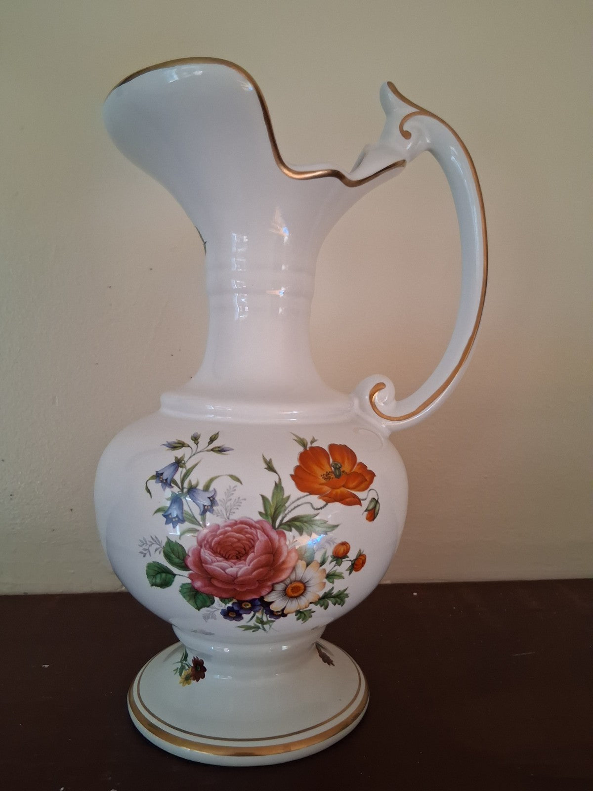 Porcelain vase with hand-painted floral decoration and gilt accents