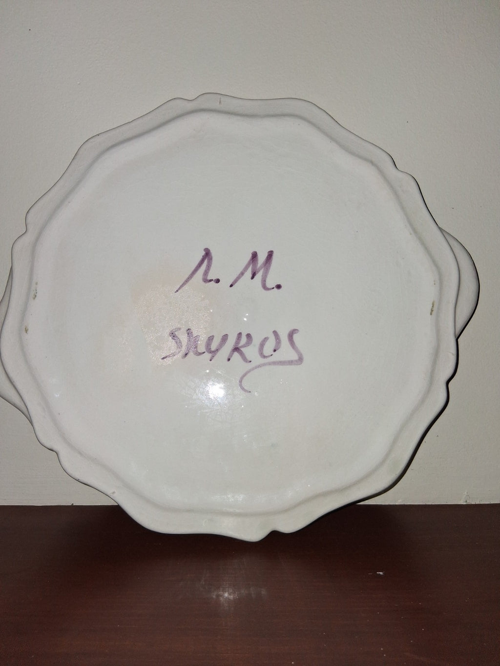 Hand-painted ceramic decorative plate with peacock and floral motif