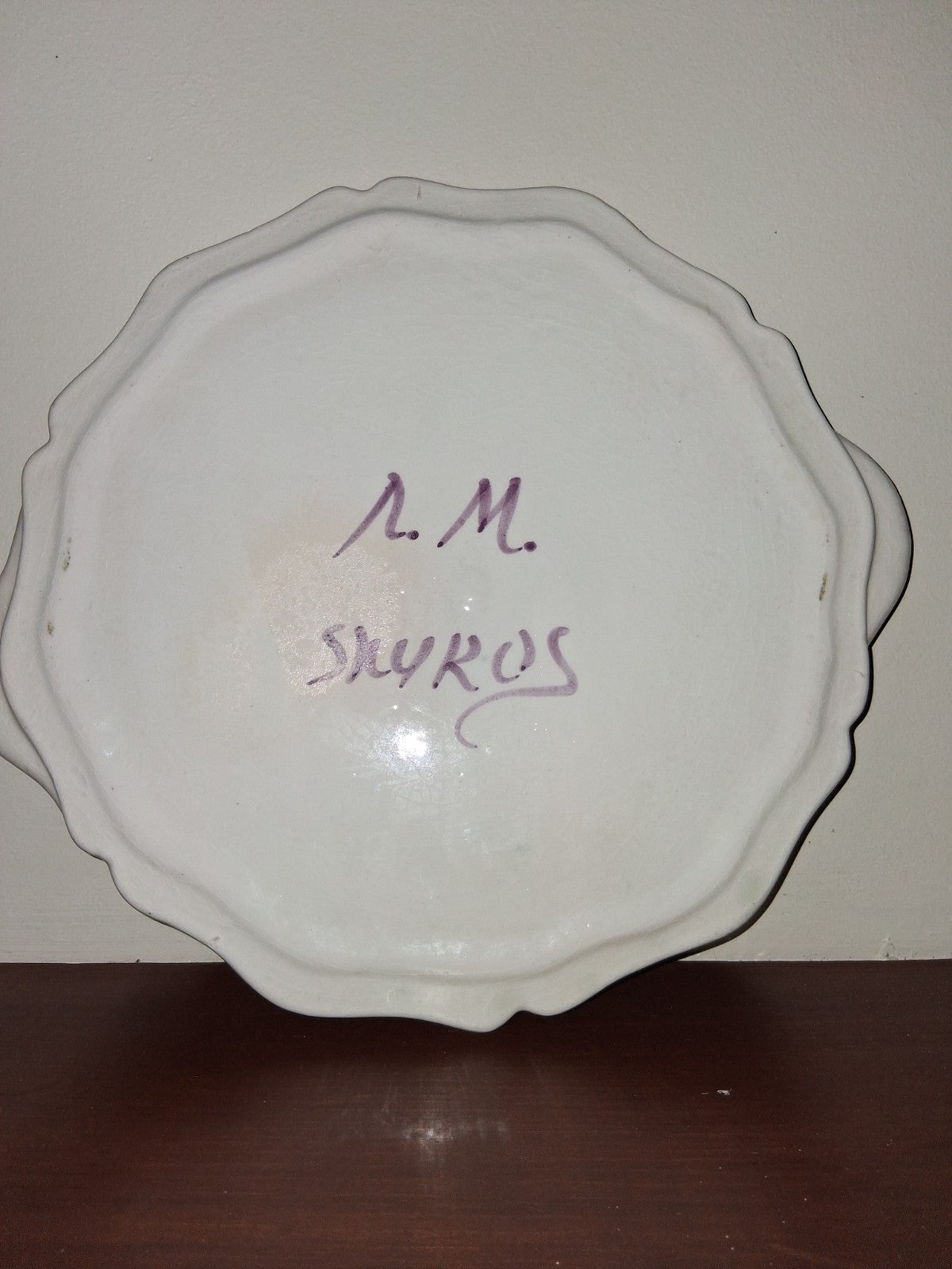 Hand-painted ceramic decorative plate with peacock and floral motif