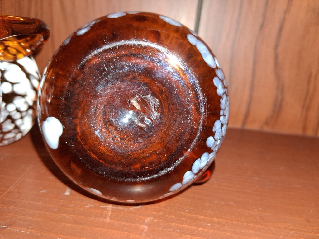 Pair of pressed glass sugar bowls in amber carnival glass Star and File pattern