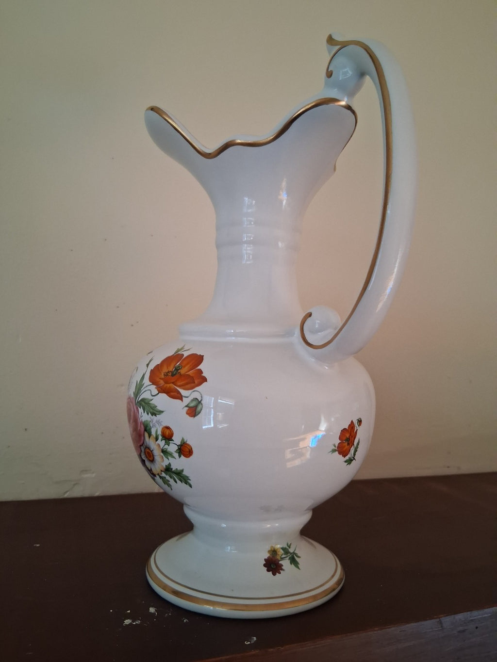 Porcelain vase with hand-painted floral decoration and gilt accents