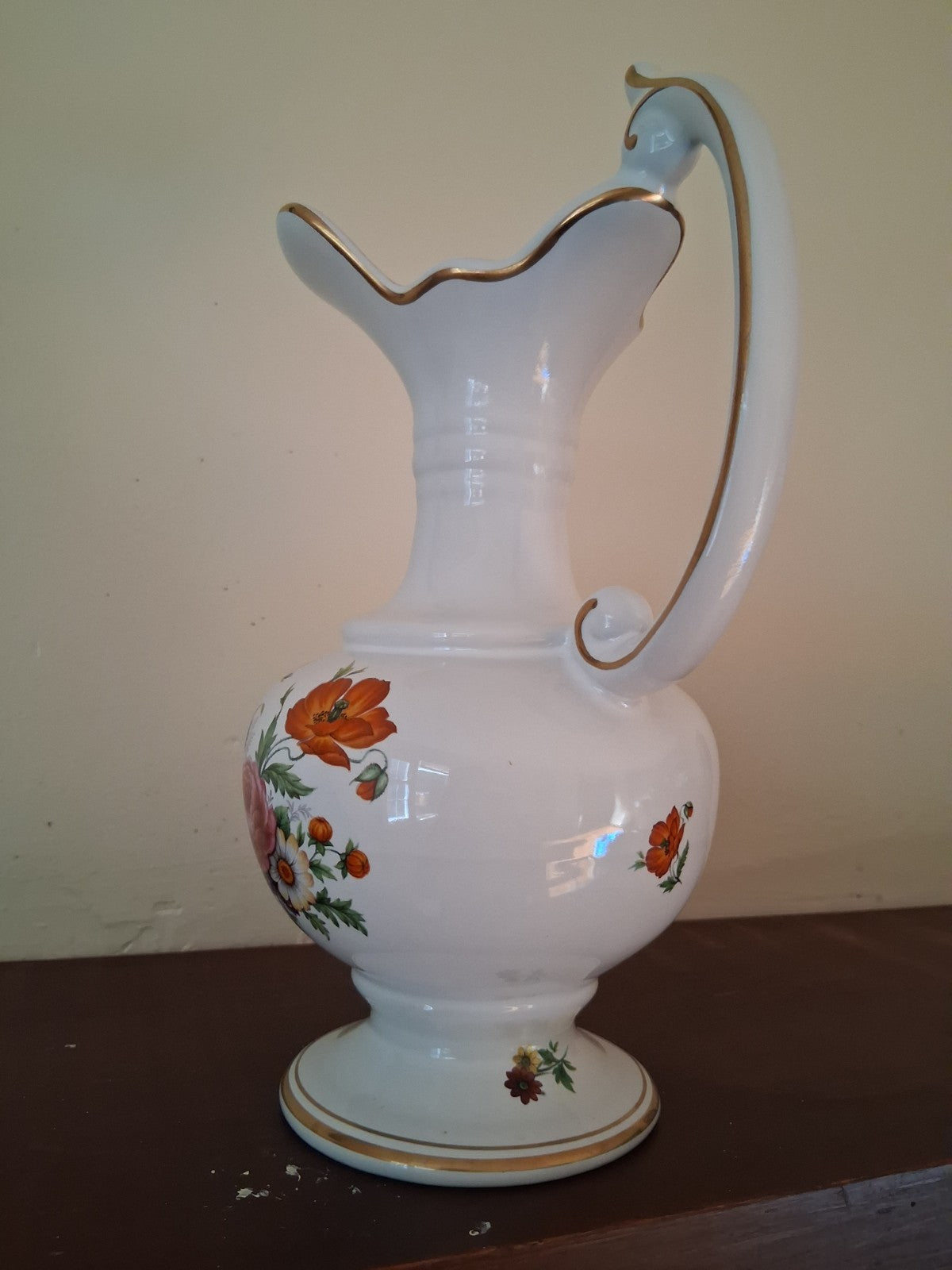Porcelain vase with hand-painted floral decoration and gilt accents