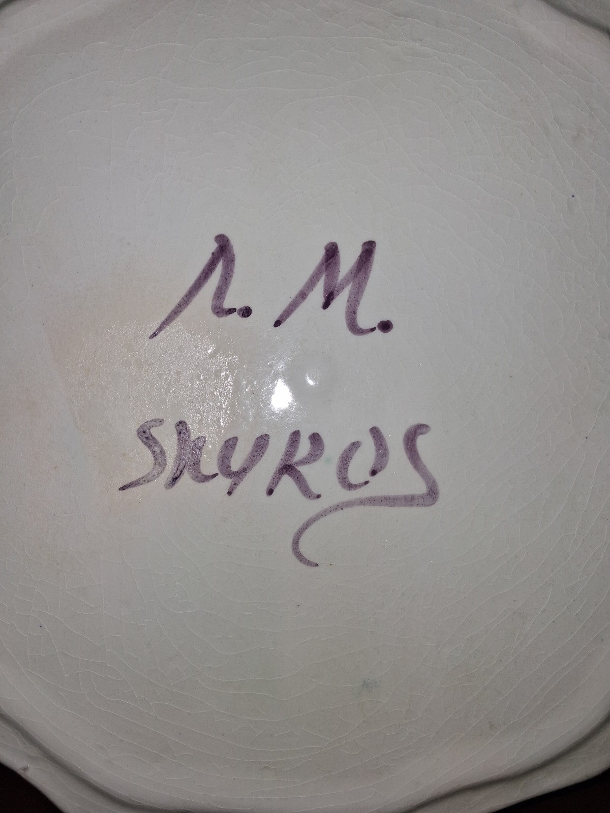 Hand-painted ceramic decorative plate with peacock and floral motif