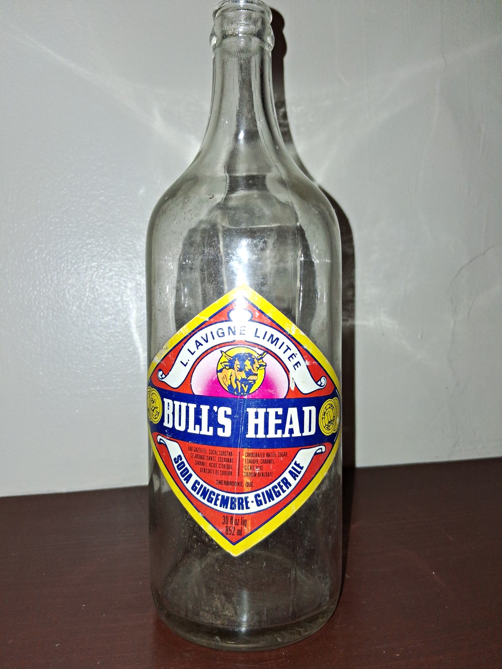  Glass soda bottle with 'Bull's Head Ginger Ale' label by Lavigne Limited