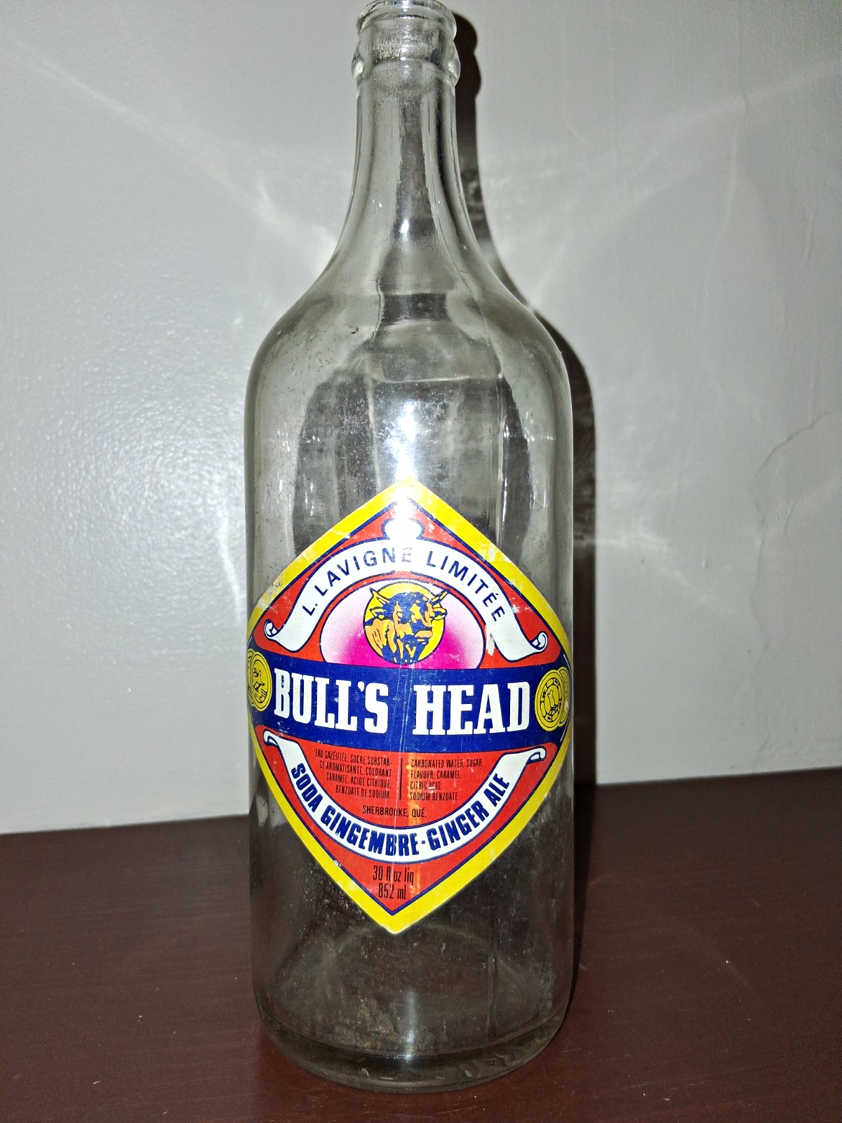  Glass soda bottle with 'Bull's Head Ginger Ale' label by Lavigne Limited