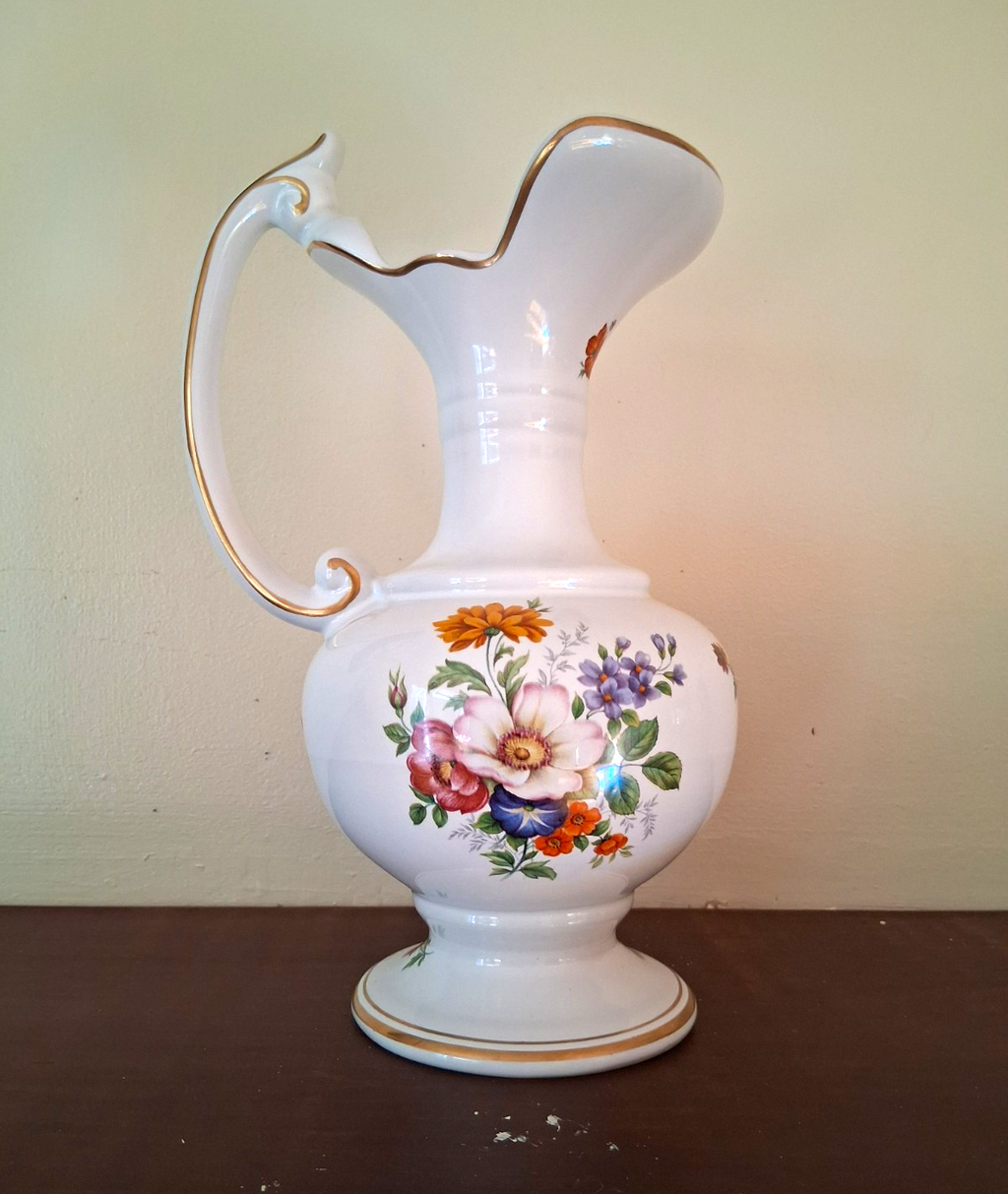 Porcelain vase with hand-painted floral decoration and gilt accents