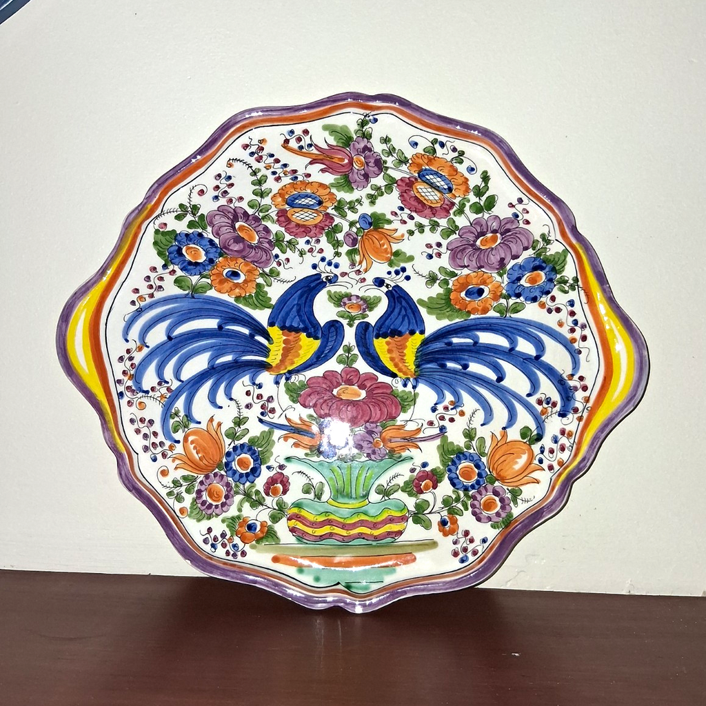 Hand-painted ceramic decorative plate with peacock and floral motif